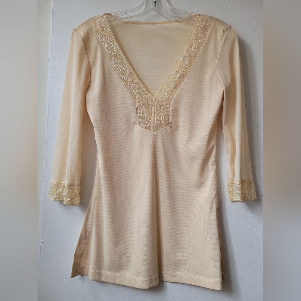 Size S - cream top with beadwork at the neckline and bottom of sleeves